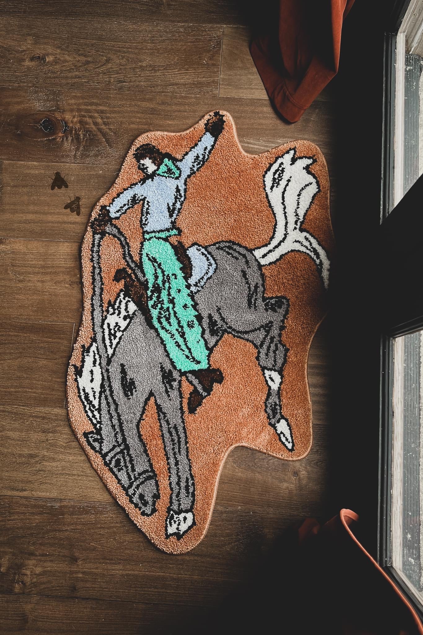 Cowboy riding a bronc rug